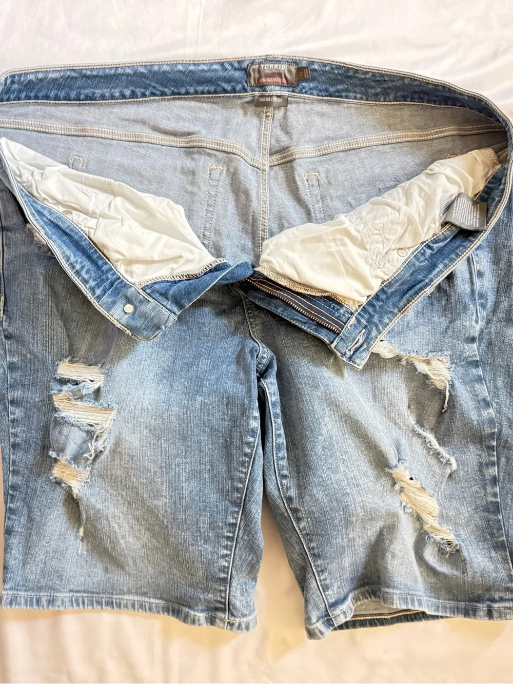 torrid light blue distressed denim shorts
